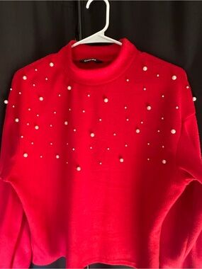 chic red mock neck sweater with pearl accents